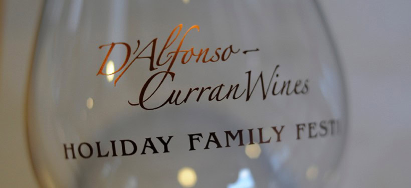 Close-up of D'Alfonso-Curran Wines glass at holiday family fest.